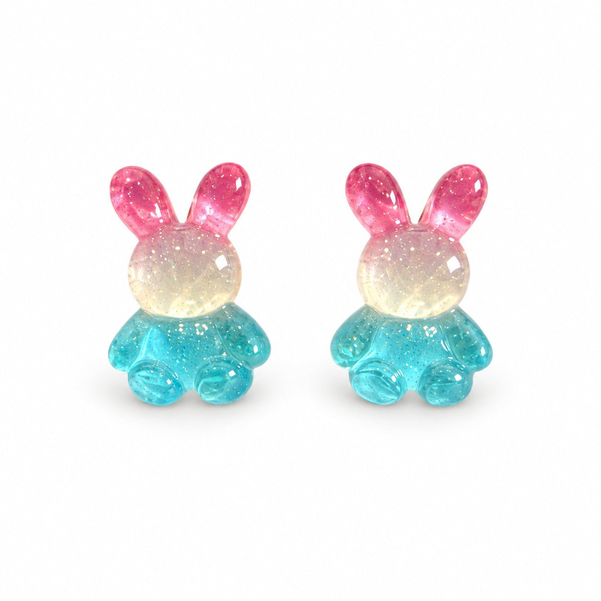 Boucles d’oreilles lapin rose blanc bleu sur fond blanc